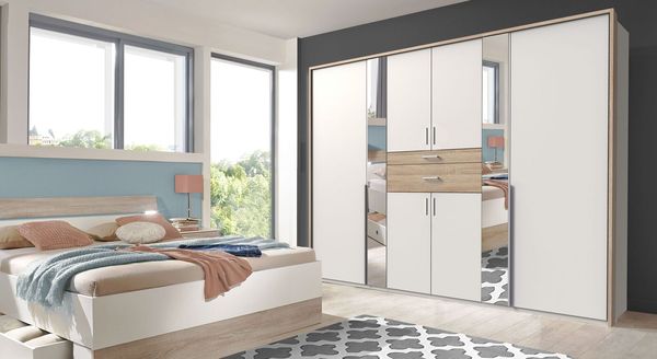 Drehtüren-Kleiderschrank Kormoran Eiche Dekor mit Spiegel und Schubladen 270x209,5 cm